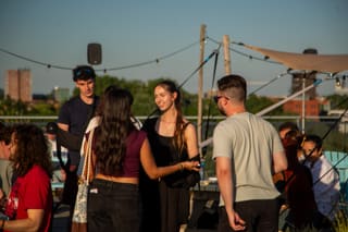 An outdoor community gathering in a circle