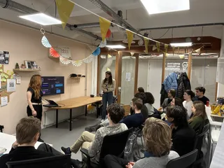 Two organisers presenting the chapter's plans to a full room